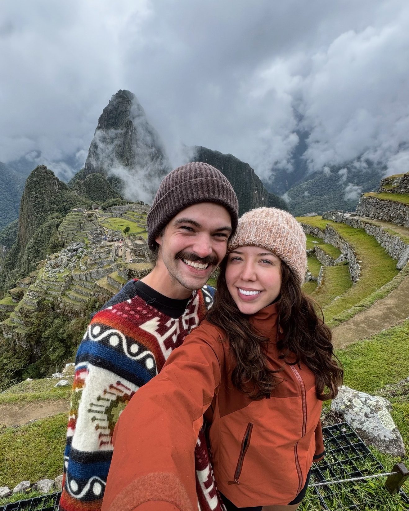 A couple enjoying the view of Machu Picchu