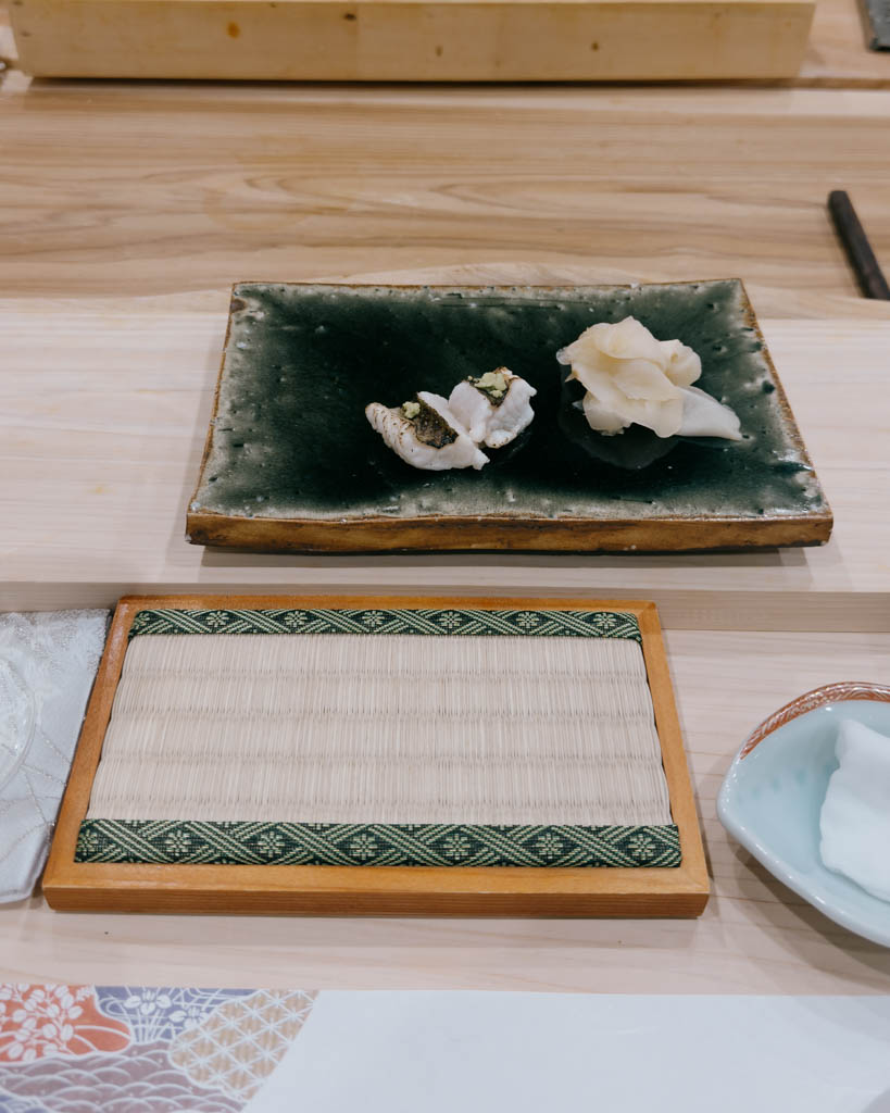 A course of nigiri sushi plated with pickled ginger during an omakase dinner in Tokyo