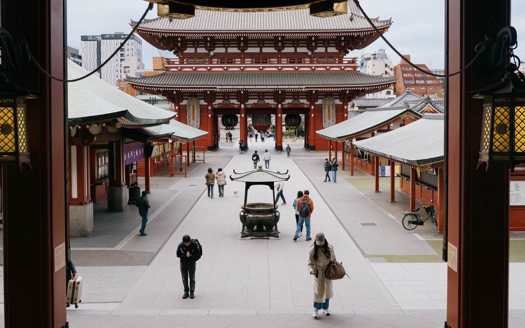Quiet view through Hozomon Gate toward Senso-ji's main hall with few visitors in the early morning