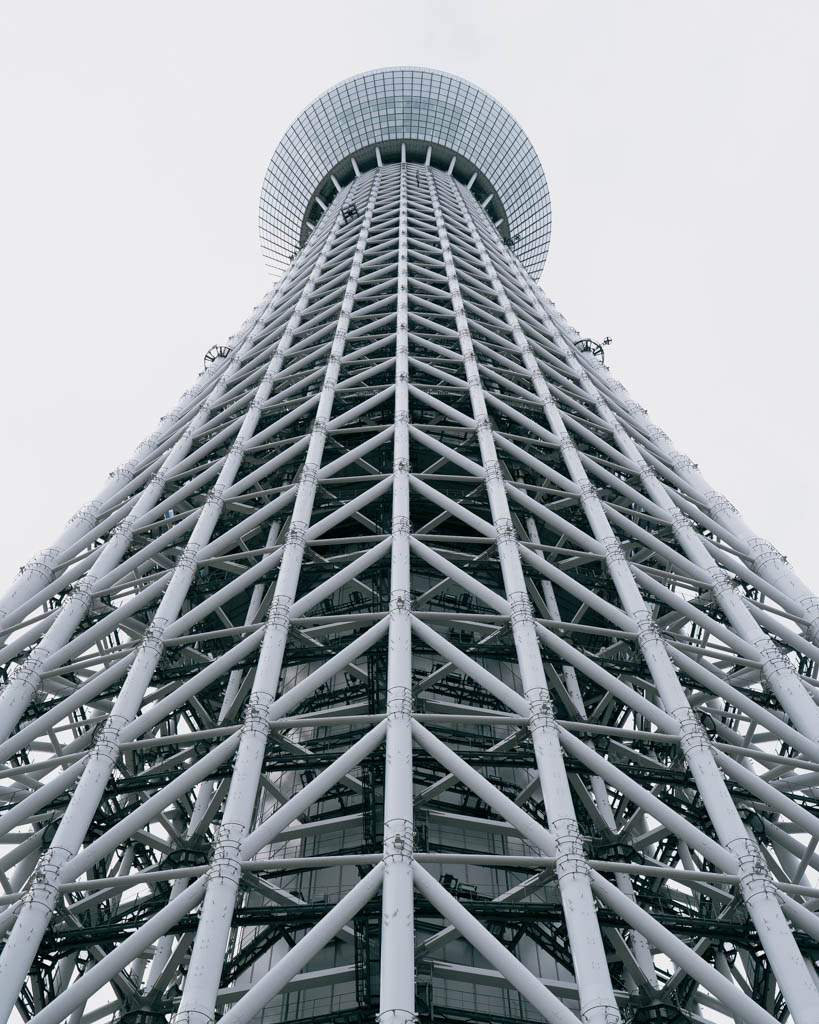 Looking straight up at Tokyo Skytree's lattice structure and observation deck