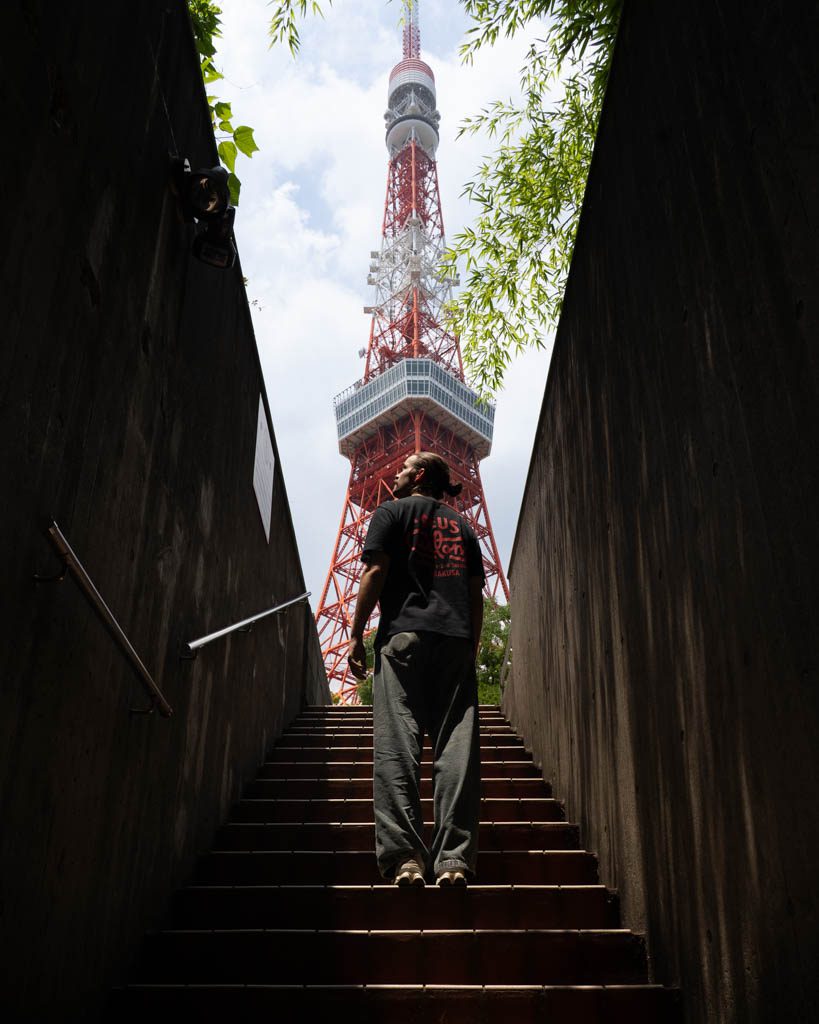 Tokyo Tower framed between staircase walls at the famous underground car park photo spot