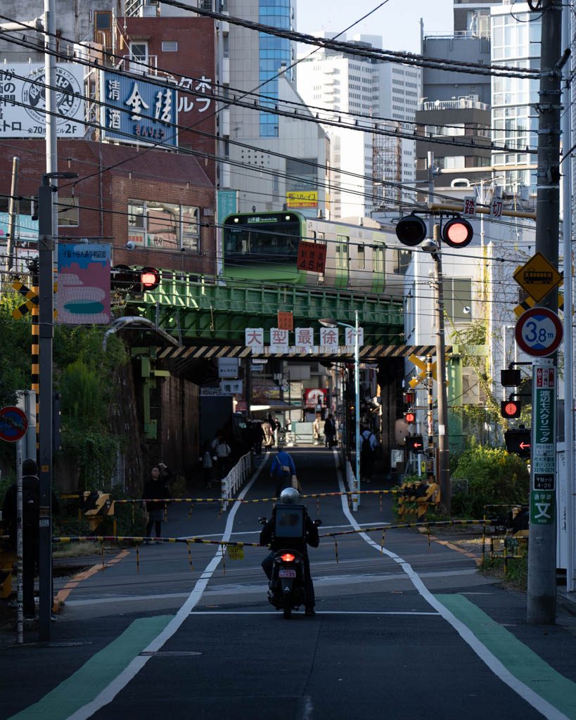 Yamanote line train crossing the iconic railway bridge photo spot in Yoyogi, Tokyo