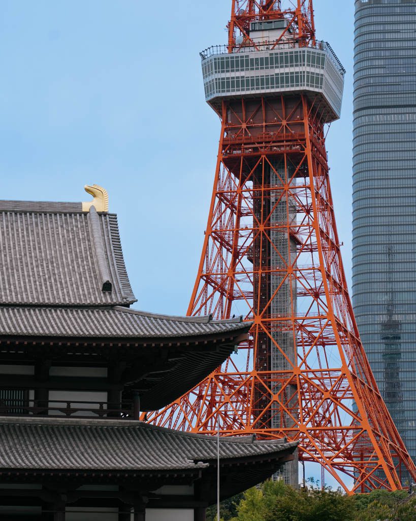 Zojo-ji Temple's traditional roof with Tokyo Tower rising directly behind it