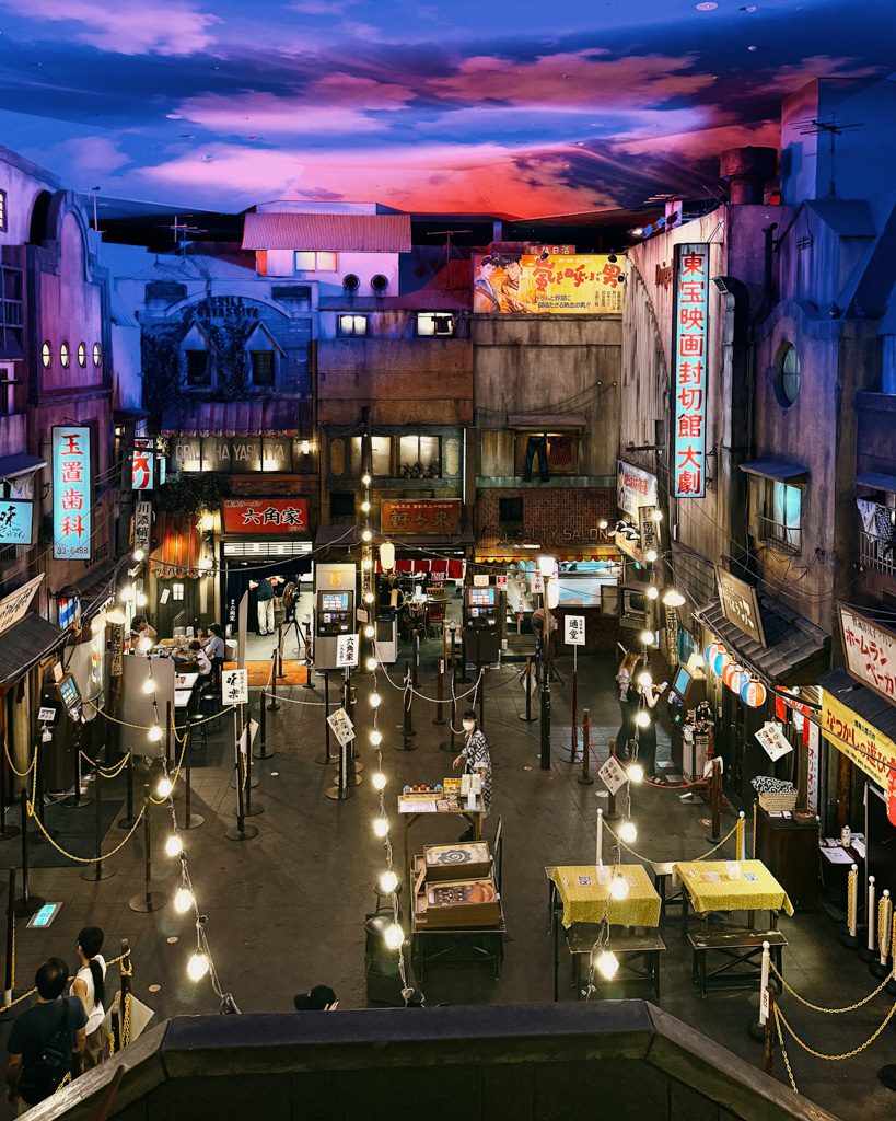 Recreated 1950s Japanese street scene with lantern-lit shopfronts inside the Ramen Museum basement