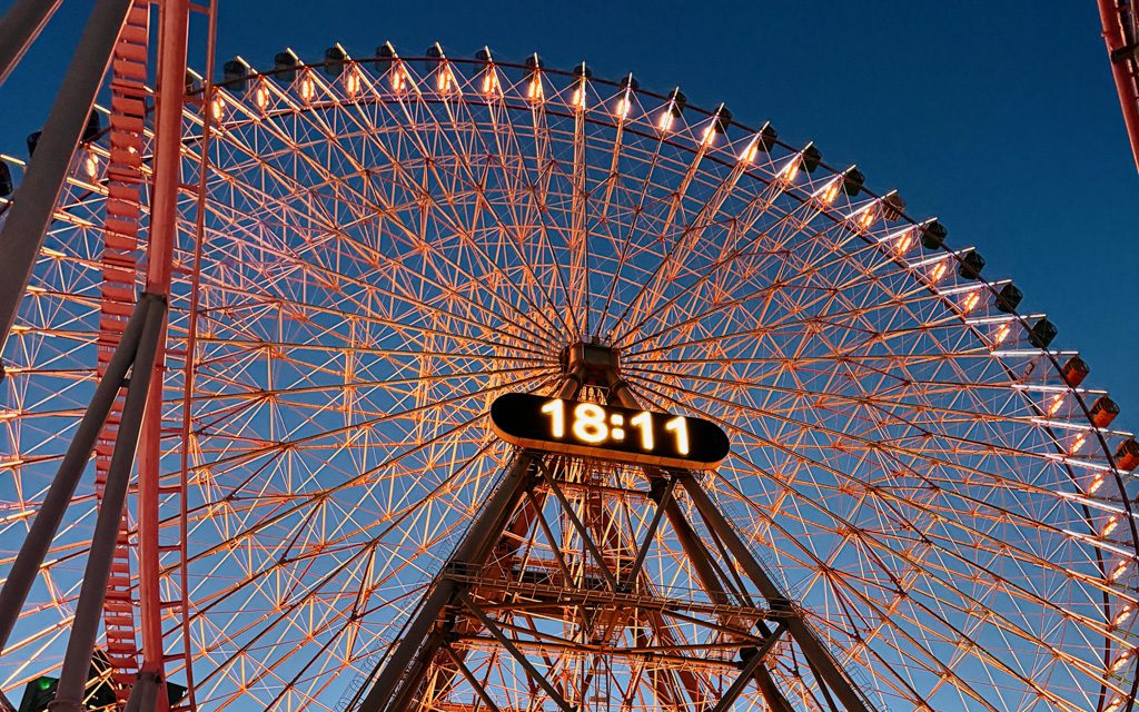 Cosmo Clock 21 ferris wheel lit up against a clear evening sky in Yokohama