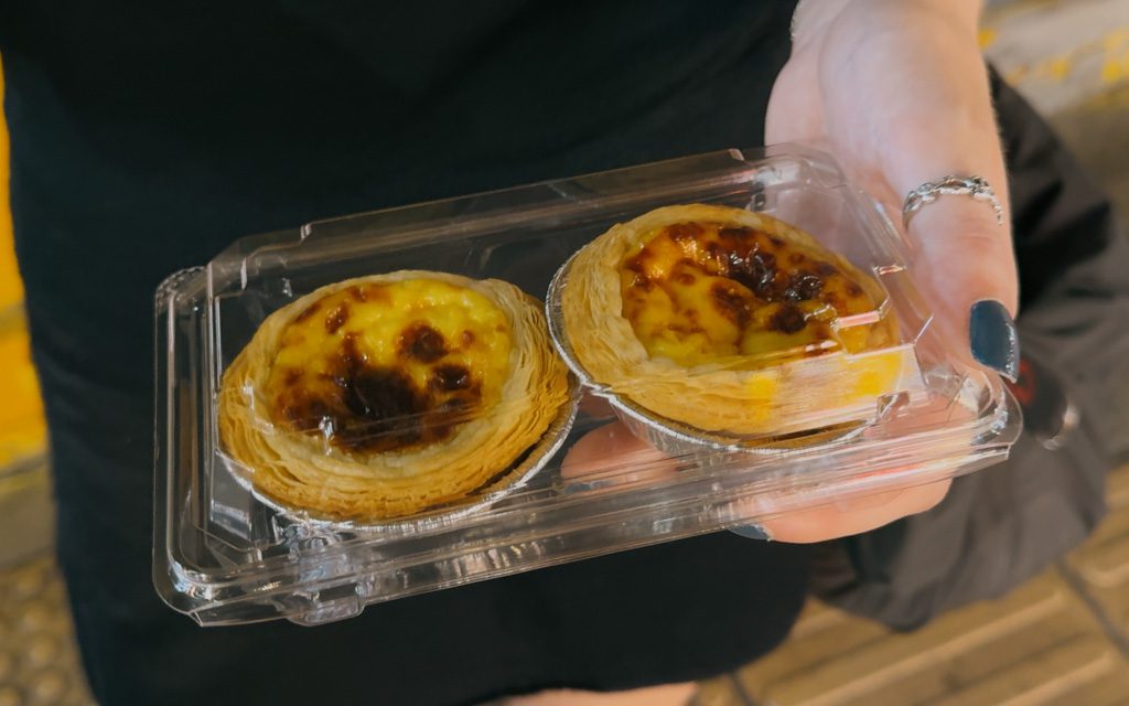 Two Portuguese-style egg custard tarts from a Yokohama Chinatown street stall