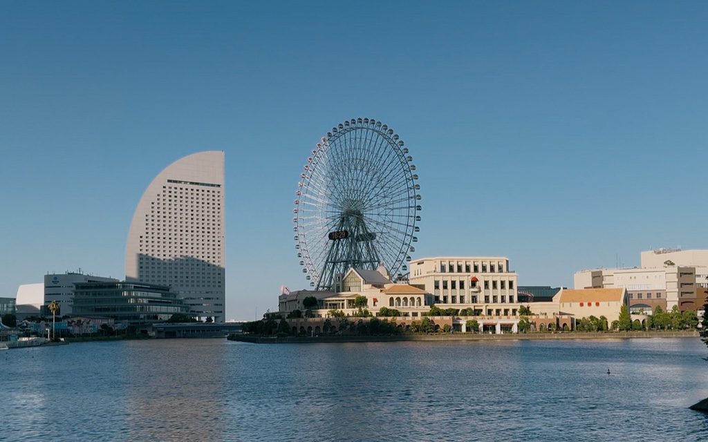 Minato Mirai harbourfront in daylight, with the Cosmo Clock 21 ferris wheel and InterContinental hotel skyline