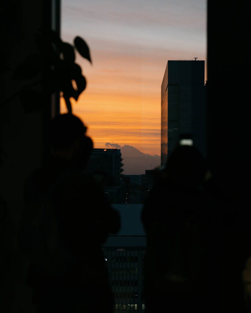 Mount Fuji silhouette at sunset seen from Shibuya Hikarie Sky lobby