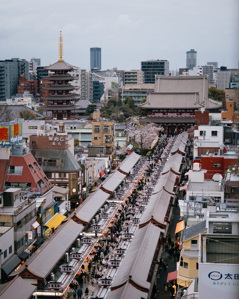 Aerial view of Senso-ji Temple in Tokyo, showing the five-storey pagoda and Nakamise-dori shopping street leading to the main hall on our senso-ji temple guide