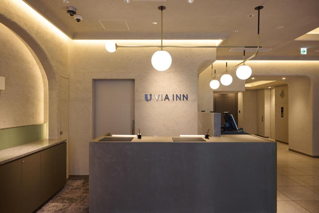 Via Inn Shinjuku reception desk with pendant lighting and check-in counter