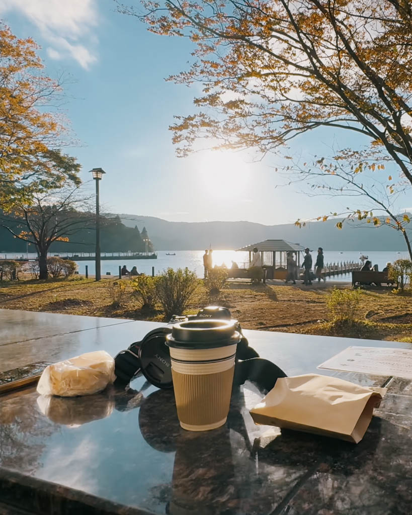 Coffee and pastries from Bakery & Table on a table overlooking Lake Ashi