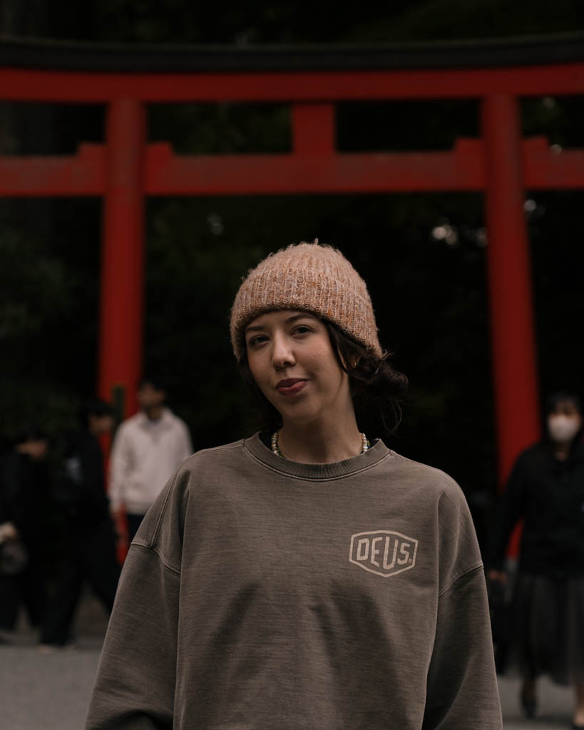 Standing in front of the red torii gate at Hakone Shrine