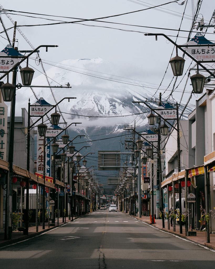 Honcho Street's retro lamp posts and shop signs framing Mt Fuji at the end of the road