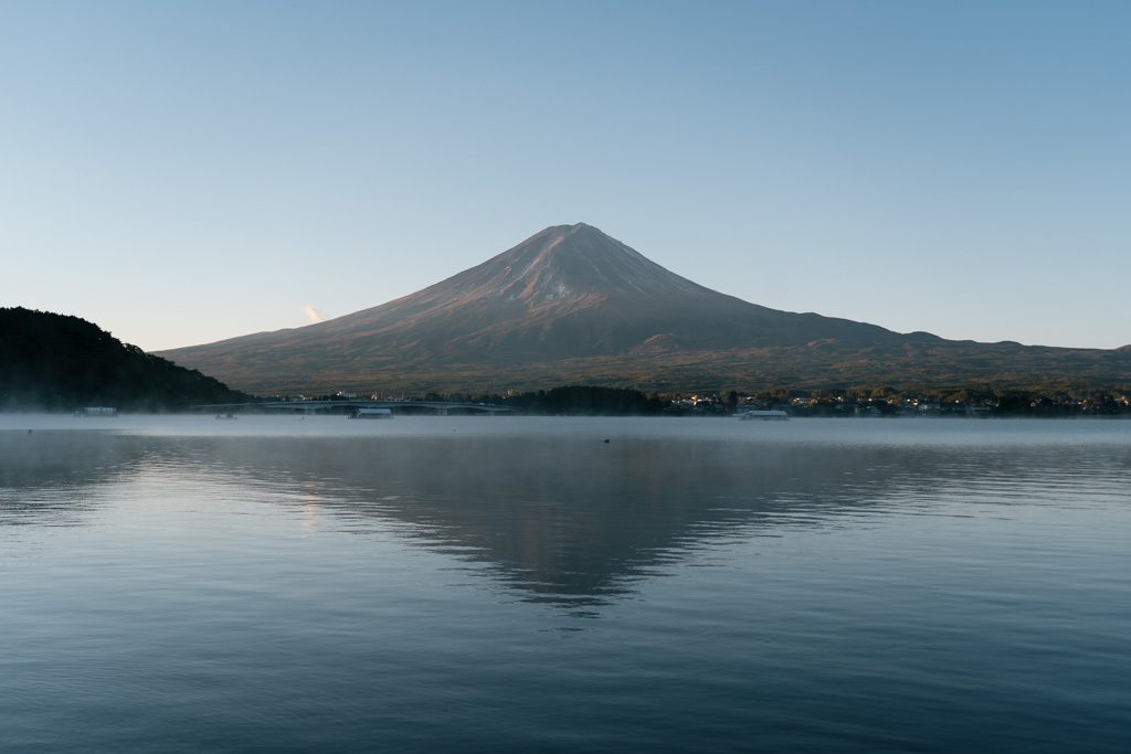 Mt Fuji reflected in the still waters of Lake Kawaguchiko at dawn
