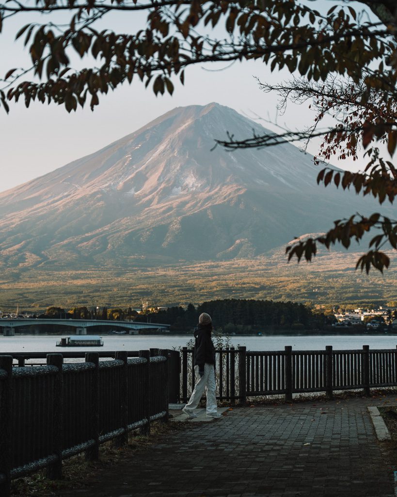 Person looking out at Mt Fuji across Lake Kawaguchiko at sunset